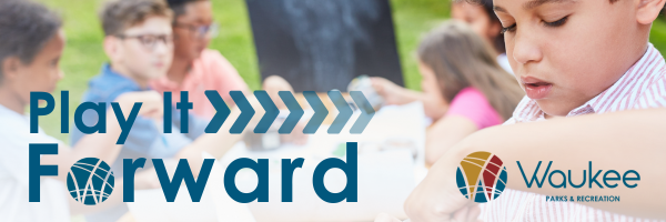 kids doing painting class on a picnic table in a park