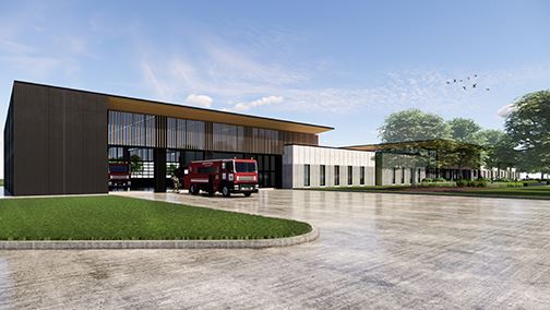 Tall garage with windows and see through garage doors with fire truck parked in front