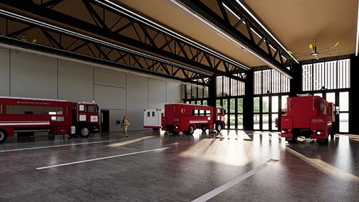 Interior view of fire apparatus bay with fire truck and ambulance