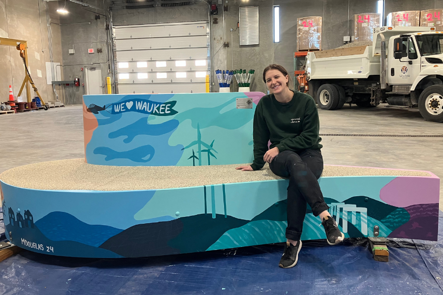 bench painted with scenes of wind turbines and the art piece at the Raccoon River Valley Trailhead